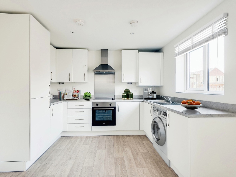 The kitchen image shown is a CGI dressed representation, taken in an actual 2 bed house at Cross Trees Park