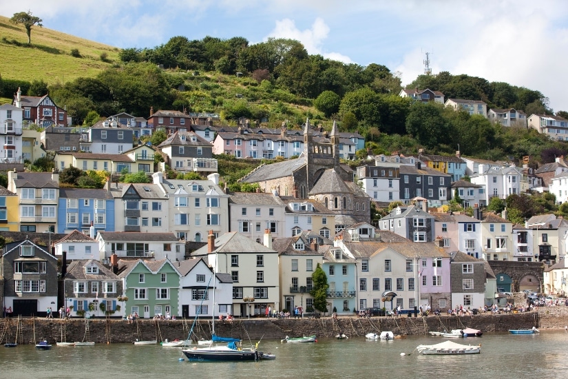 View of the colourful hillside houses at Bynards Cove at picturesque Dartmouth Harbour, Devon