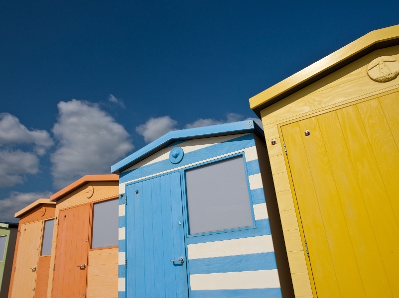 Photo of colourful wooden Beach huts, Seaford