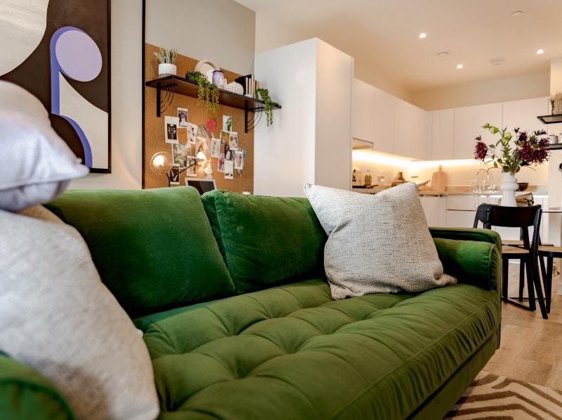 Photograph of plot 1309's lounge space, with a view of the kitchen, which is a one bed apartment at The Acer Apartments in White City, London.
