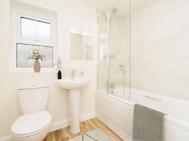 The bathroom image shown is a CGI representation of an actual Shared Ownership house at The Ostlers.