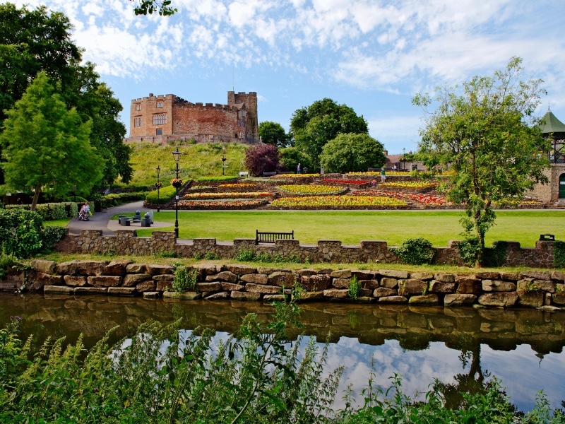 Exterior photo of lake in front of the Castle and Castle Park Gardens, Tamworth
