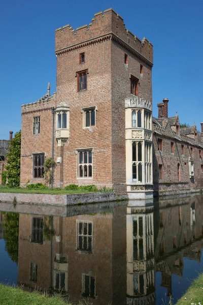 Exterior photo of building and moat at Oxburgh Hall