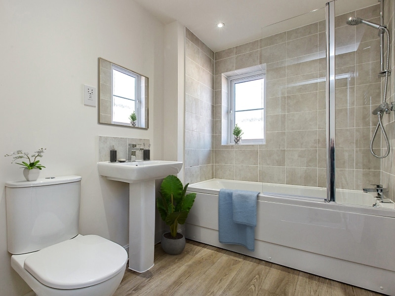 The bathroom shown is a CGI representation taken in an actual 3 bed house at Cottam Gardens