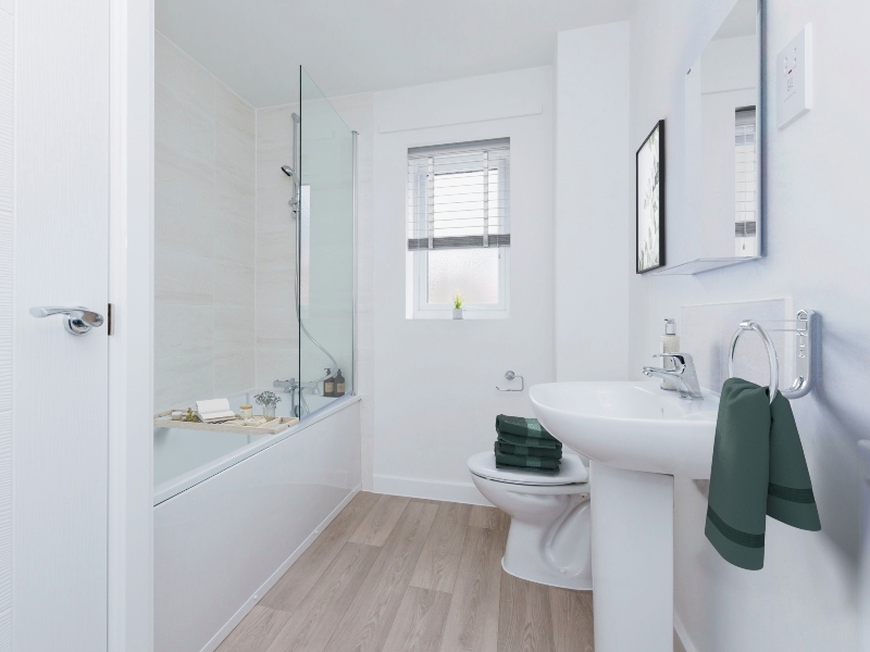 Image is a CGI representation of a bathroom with bath and shower, sink and toilet taken in an actual 2 bedroom house at Wykin Meadows, Shared Ownership Homes from Legal And General Affordable Homes