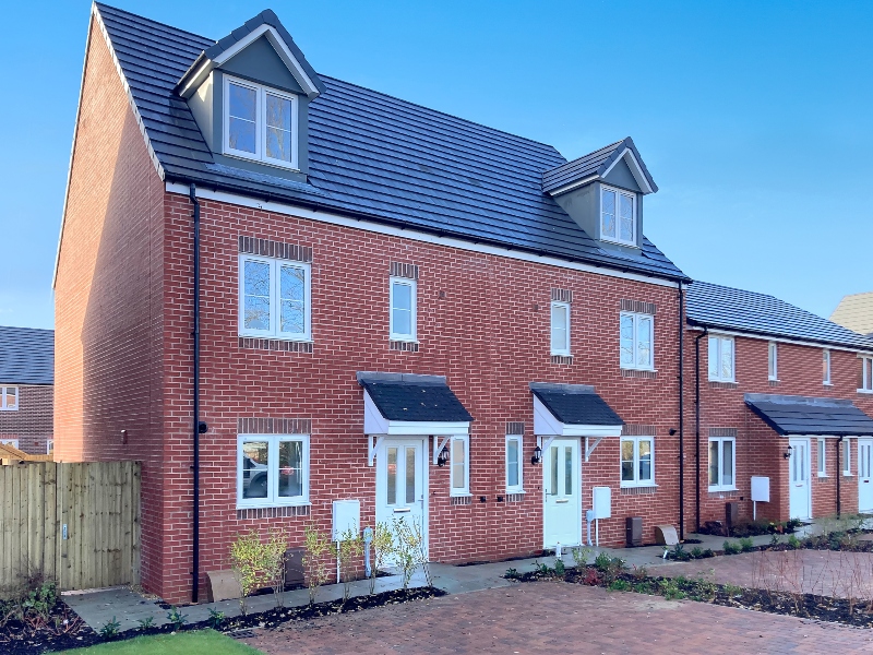 Exterior photo of two townhouses with driveway of the Shared Ownership house style at Oakcroft Chase, Hampshire