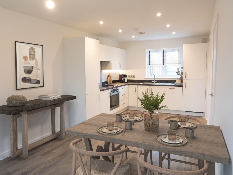 Interior CGI representation of a kitchen area with dining table and chairs taken in an actual 4 bed house at Benson Grange