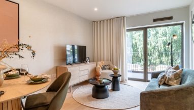 Interior photo of the Show 2 Bed Apartment Plot 21-SO-00-04, lounge and balcony area at East River Wharf in Newham, London