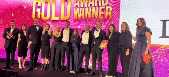 L&G Affordable Homes colleagues accepting their Gold award for Customers at the Heart of Everything