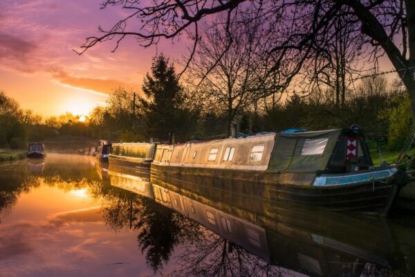 Photo of a canal barge at sunset